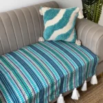 Three seater blue sofa cover with white tassels