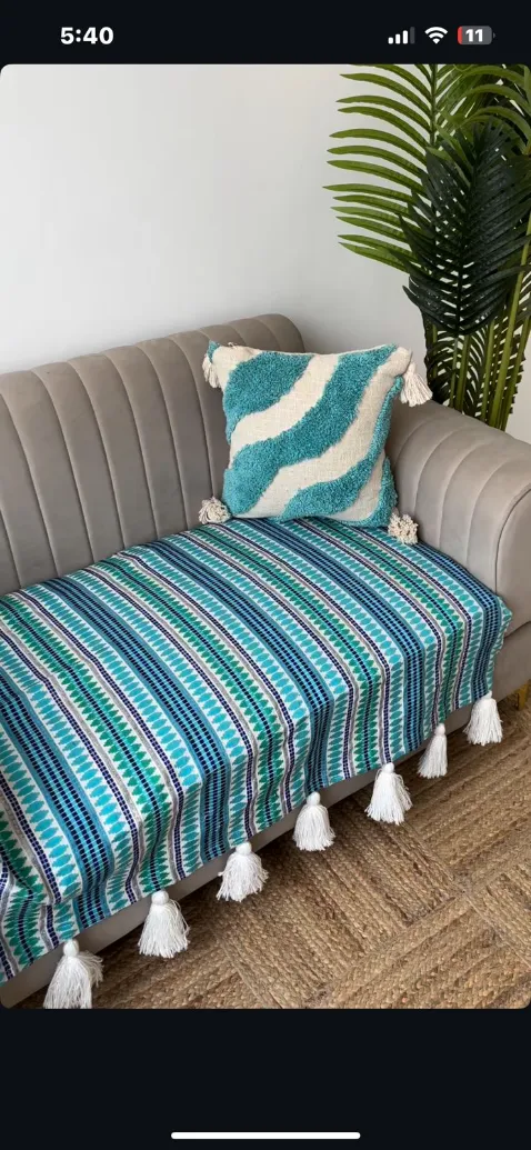 Three seater blue sofa cover with white tassels