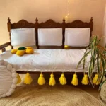 Three-seater sofa cover with yellow tassels